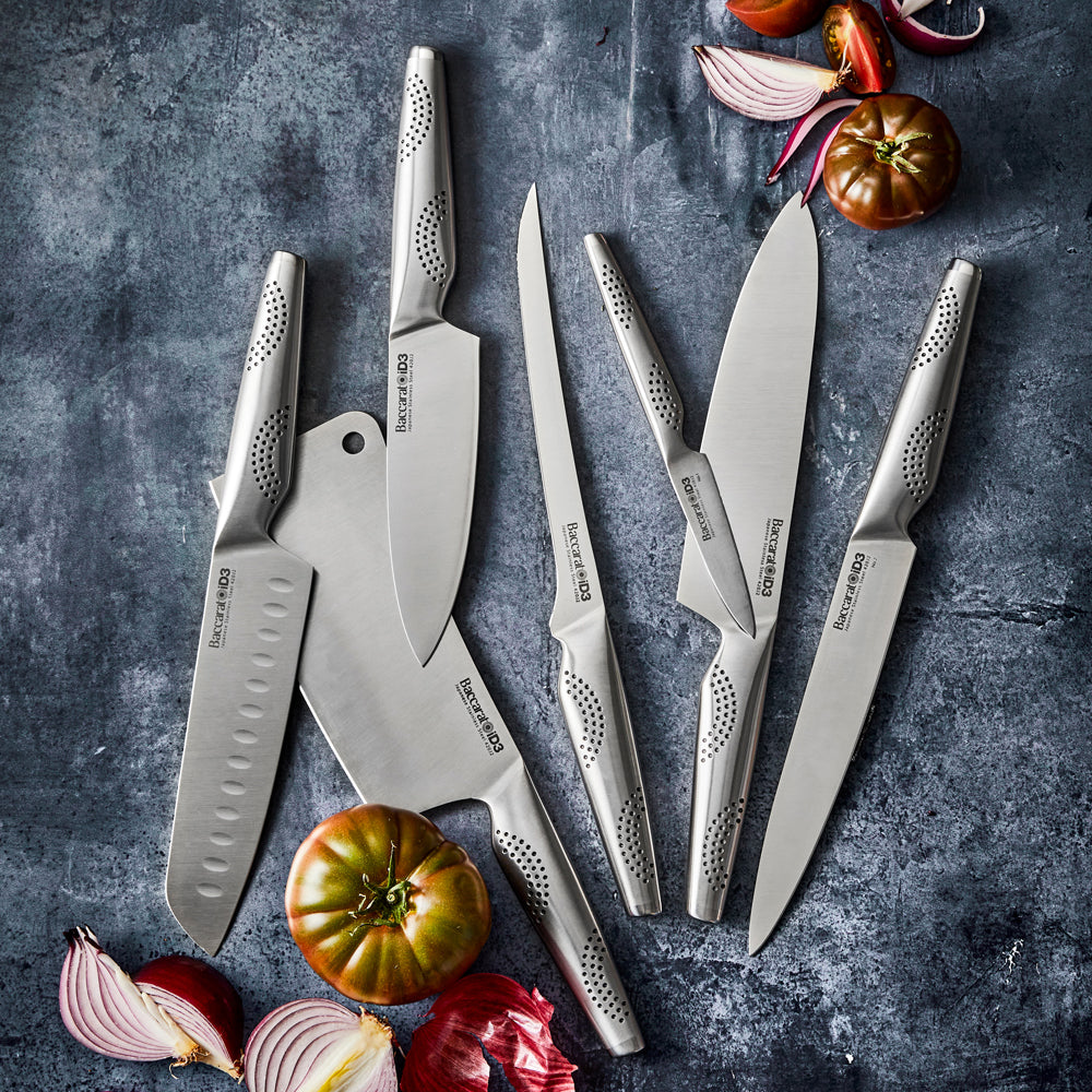 Chopped vegetables on a wooden board with fried veggies in a pan - Baccarat id3 11cm Utility Knife