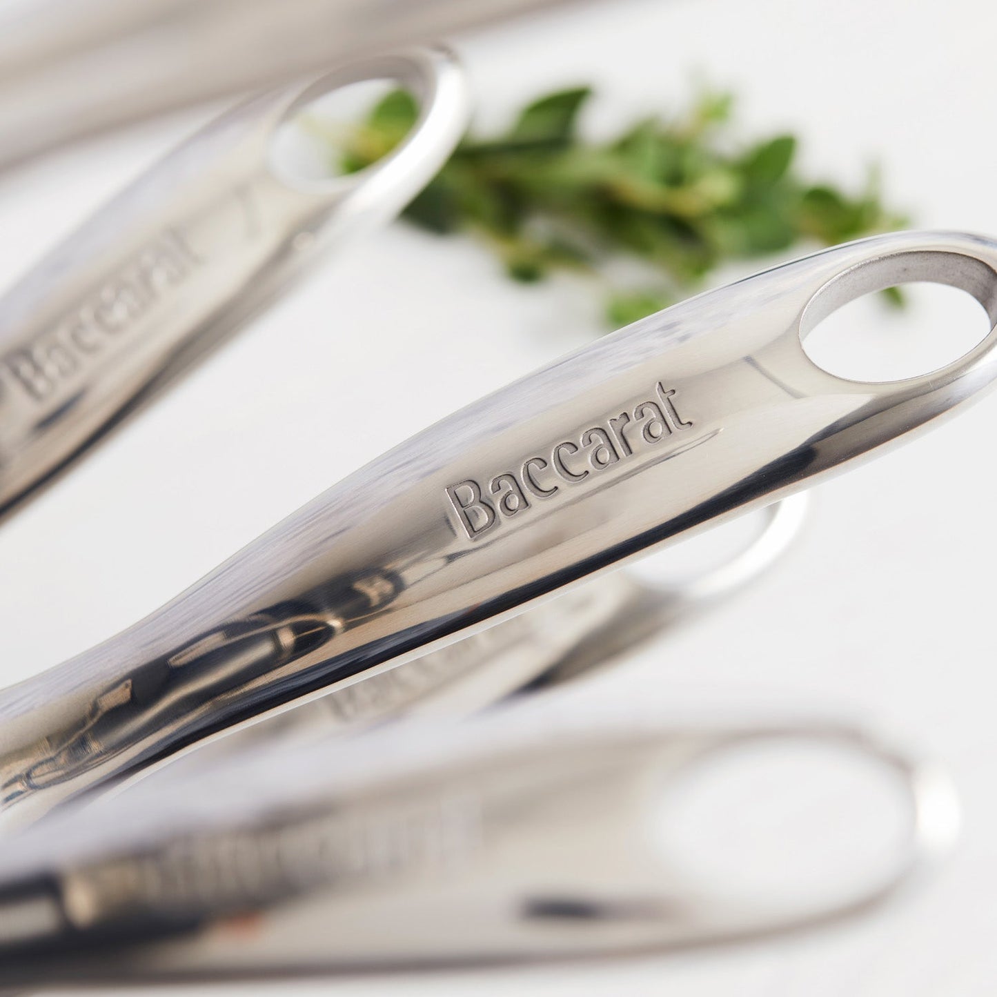 a stylish cookware set with sleek non-stick surfaces and matching lids in vibrant colours - Baccarat
