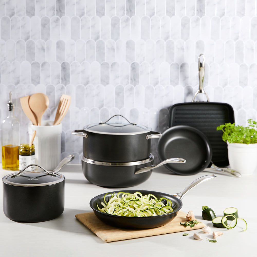 a stylish cookware set with sleek non-stick surfaces and matching lids in vibrant colours - Baccarat