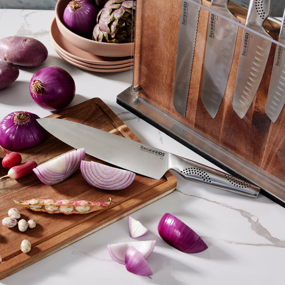 Chopping board with onions and a knife beside knife block - Baccarat id3 Ryu Knife Block 9-Piece