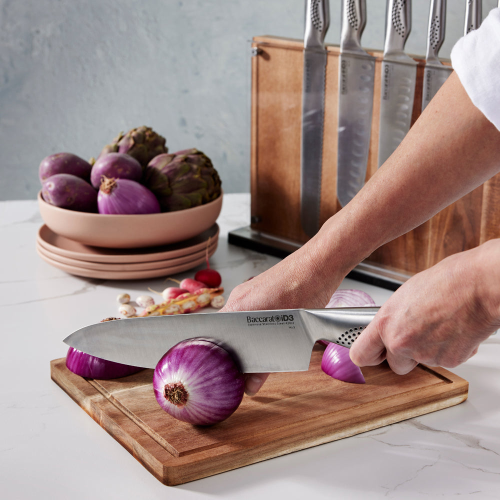 Chopping board with onions and a knife beside knife block - Baccarat id3 Ryu Knife Block 9-Piece