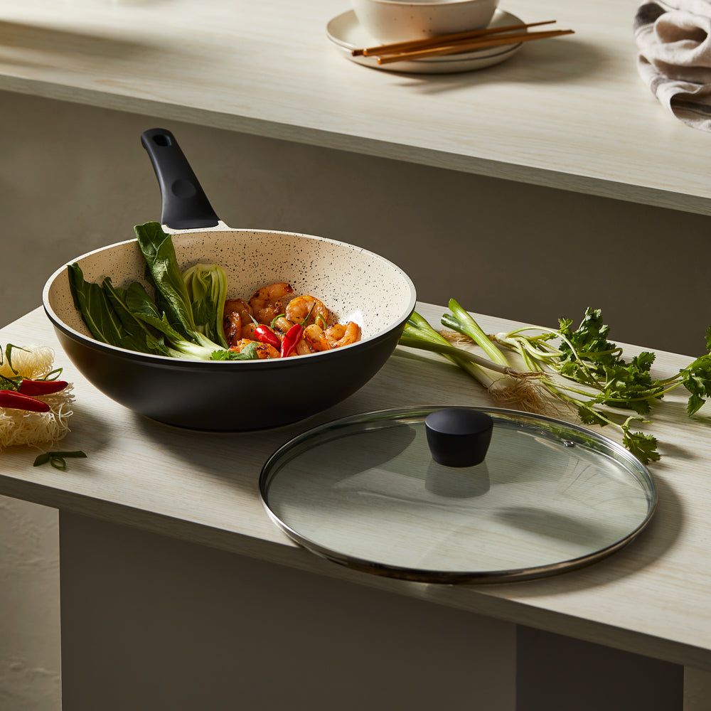 Stir frying colourful vegetables in a black ceramic pan with a glass lid - Baccarat ceramix stirfry