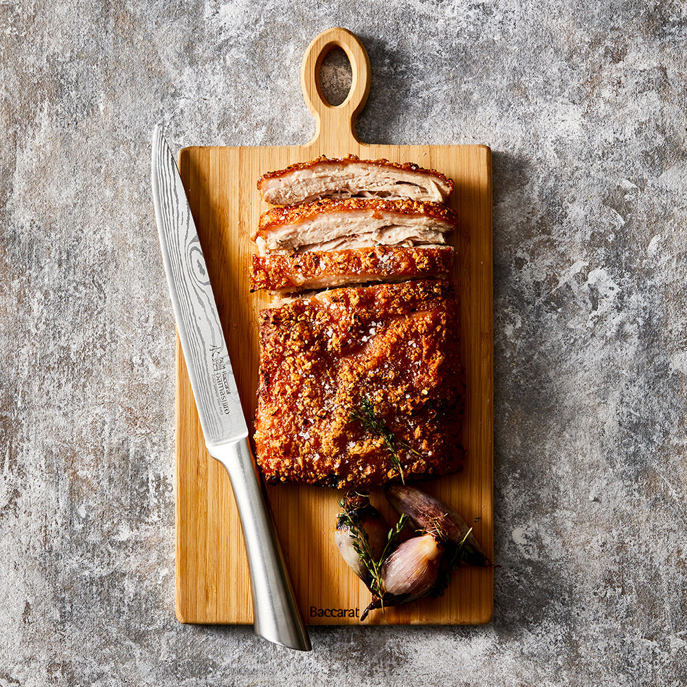 A beautifully sliced roast on wooden board with sharp blade - Baccarat Damashiro Carving Knife 20cm