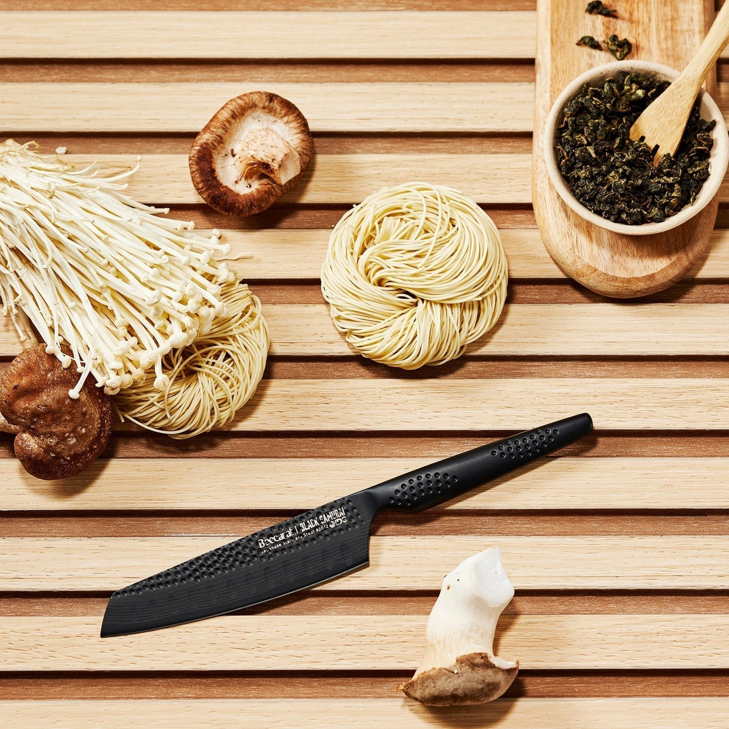 A sharp versatile santoku knife with a black handle and blade texture - Baccarat ID3 Black Samurai