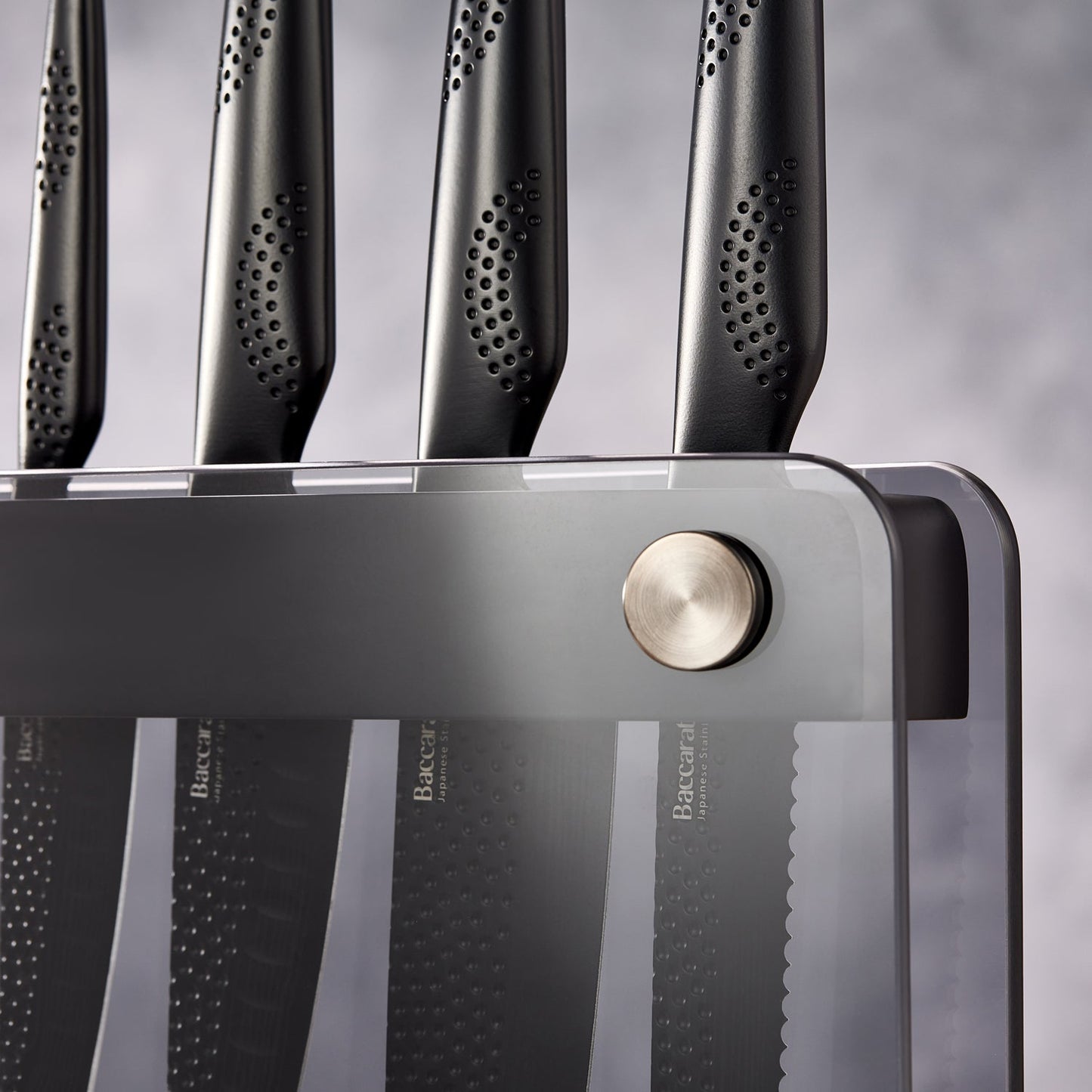 A Baccarat id3 Black Samurai Sakai knife block displaying transparent walls with fresh vegetables
