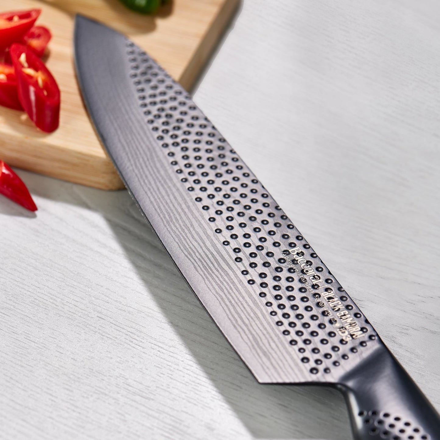 A Baccarat id3 Black Samurai Sakai knife block displaying transparent walls with fresh vegetables