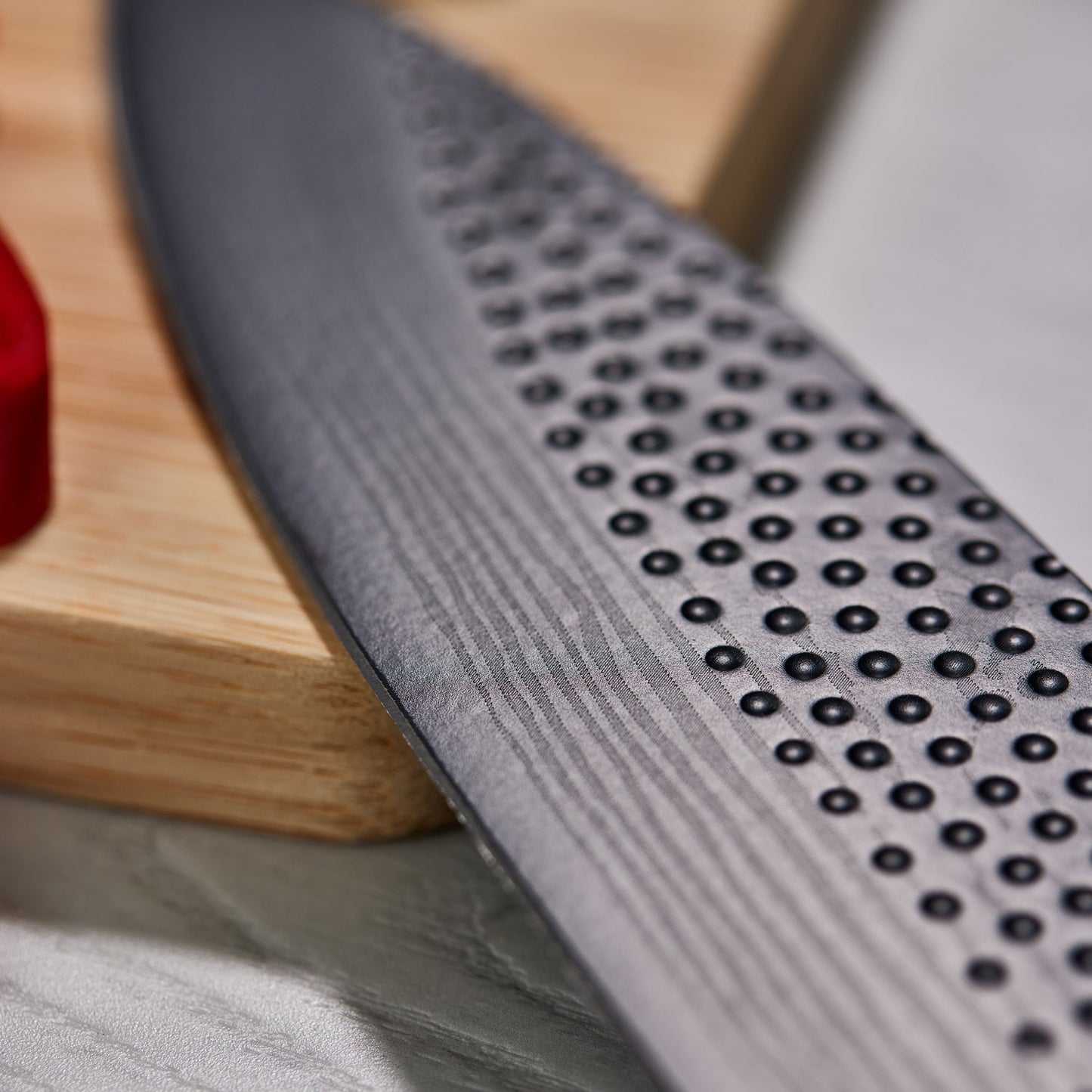 A Baccarat id3 Black Samurai Sakai knife block displaying transparent walls with fresh vegetables