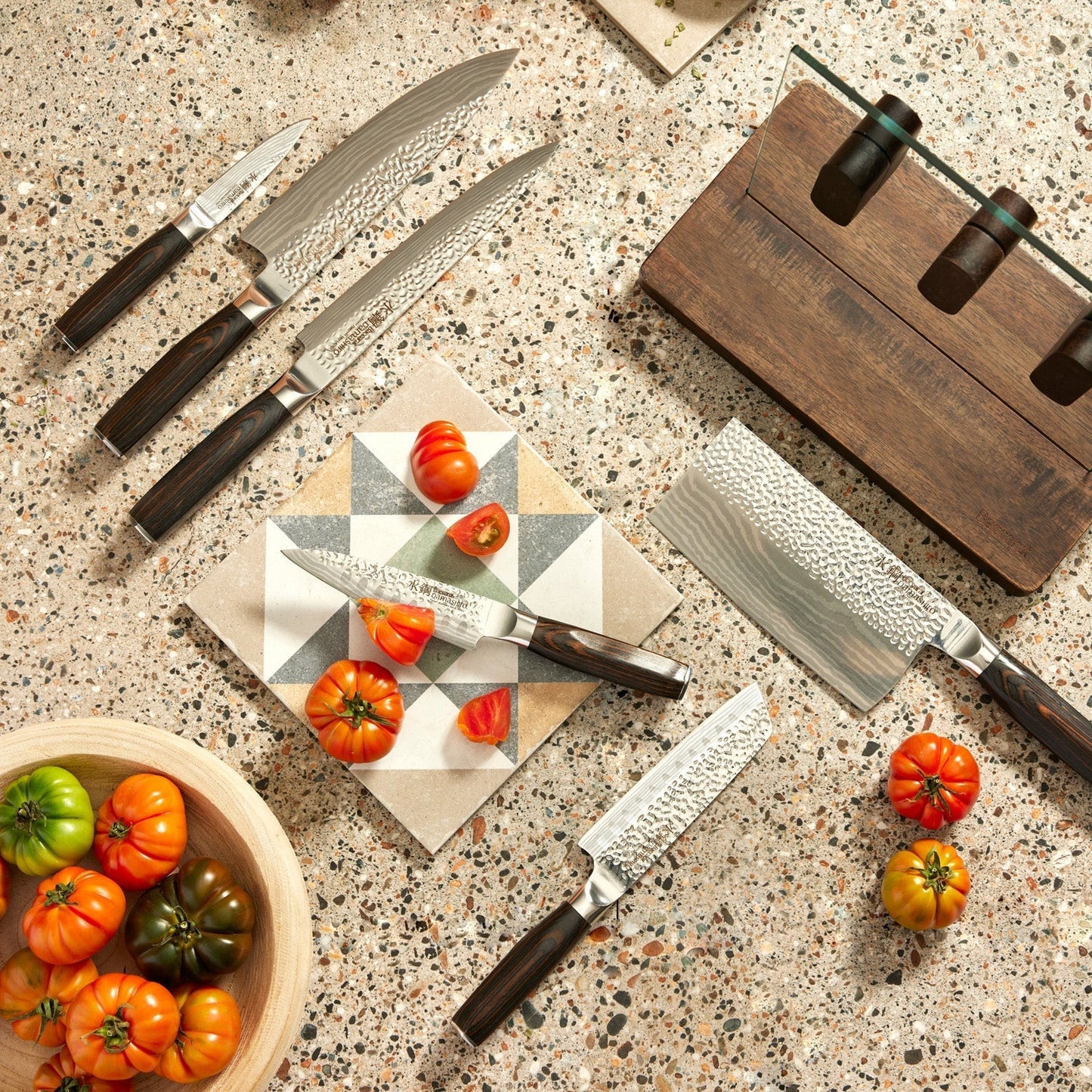 A knife on a wooden board with sleek blades on a countertop - Part of 7-piece knife block - Baccarat