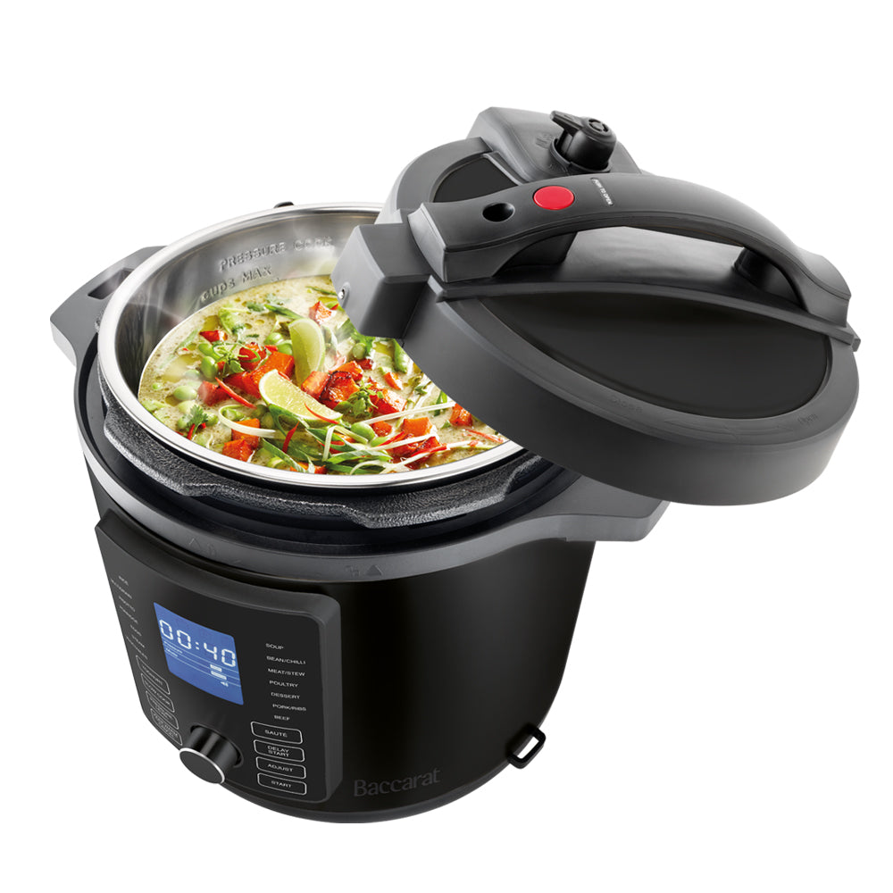 Modern kitchen with a bowl of soup and a black and silver electric mill 19cm - Baccarat spice market