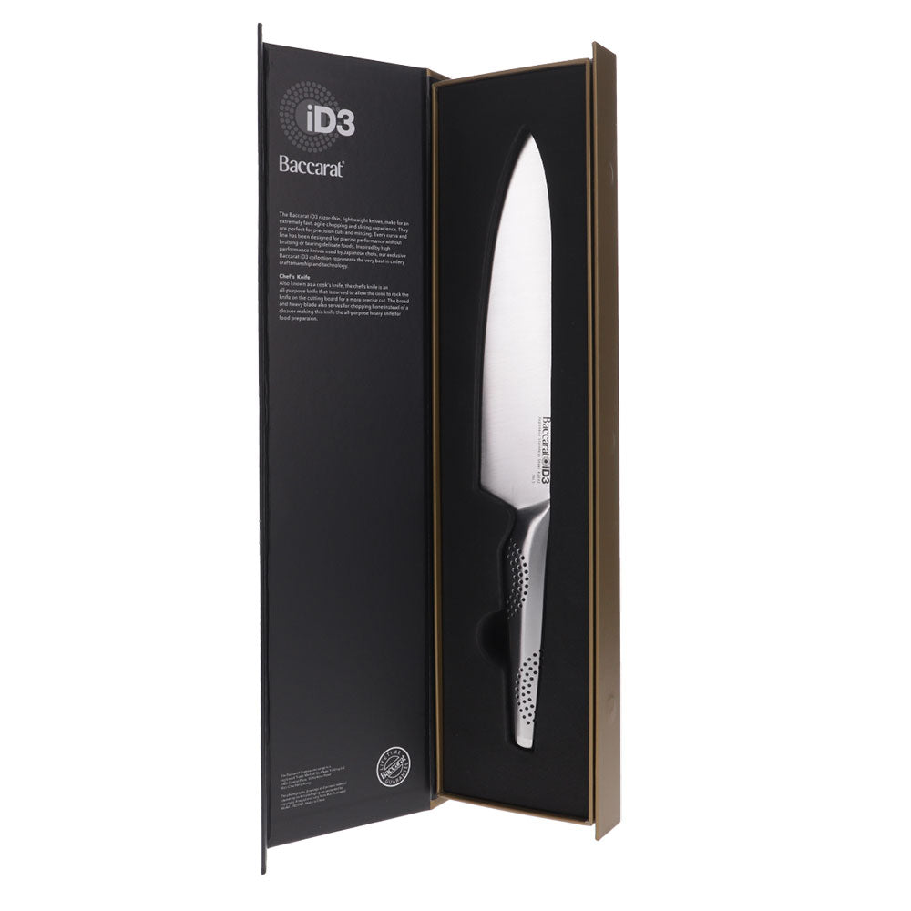A person slicing vegetables on a wooden board with a chef's knife - Baccarat id3 chefs knife 20cm