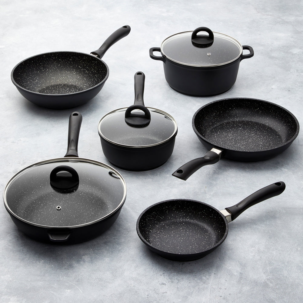 A complete cookware set with non-stick pans and pots featuring sleek black surfaces - Baccarat