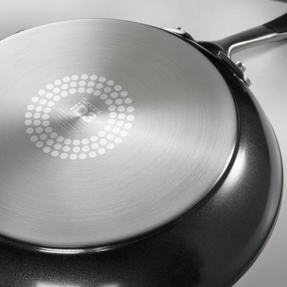 Two frying pans with bell pepper slices on a gray surface - Baccarat id3 hard anodised frypan