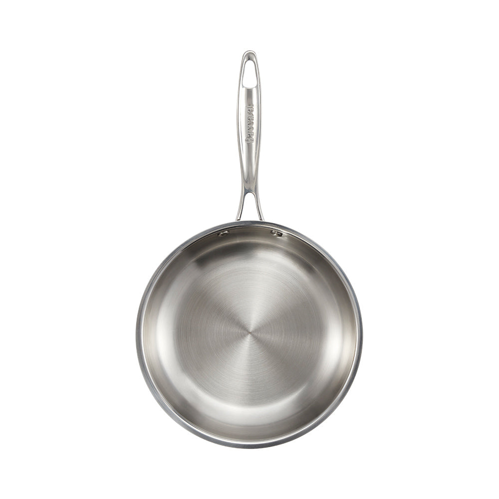a steel pan on a wooden board with pastel tableware and pancakes with berries - Baccarat