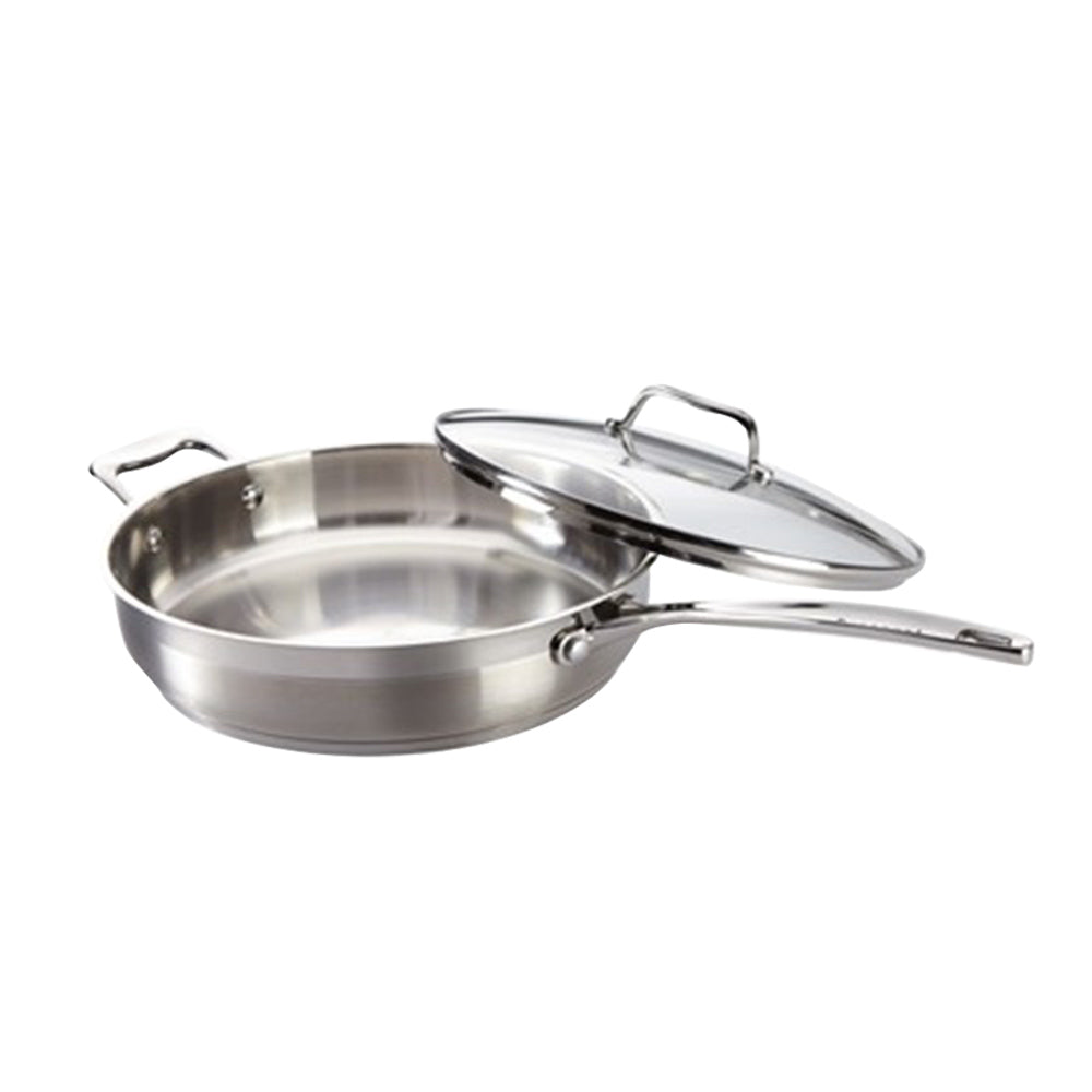 A sleek sauté pan with a glass lid that gleams in the light - silver cookware - Baccarat iconix
