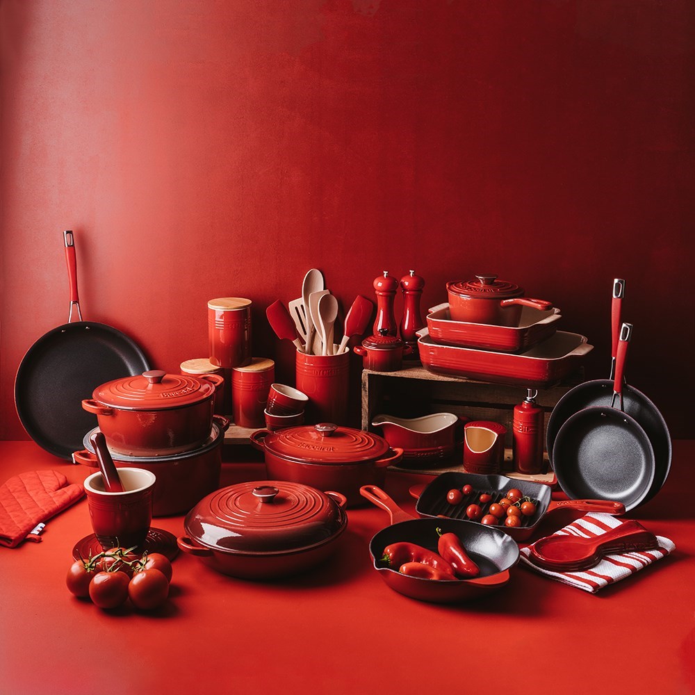 Oval cast iron French oven with lid in red color for cooking and serving - Baccarat Le Connoisseur