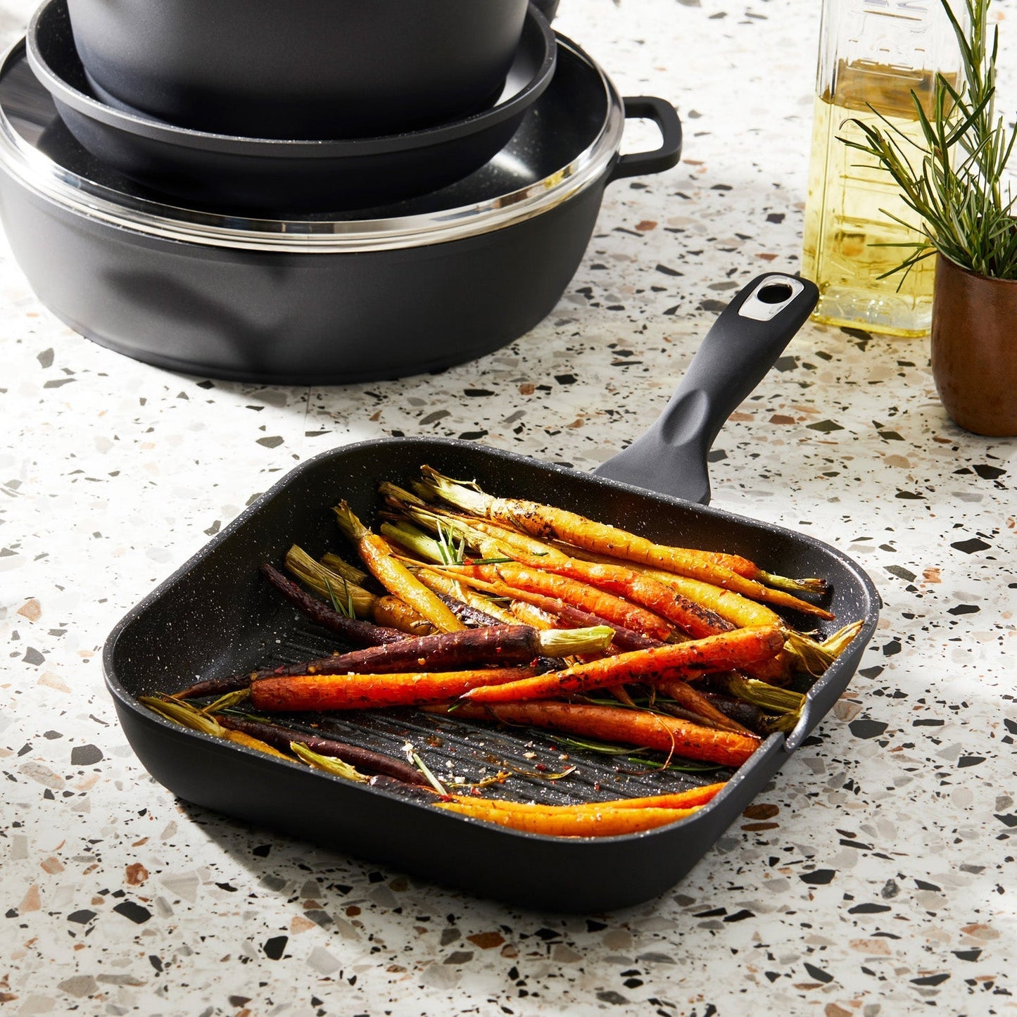 Grilled vibrant rainbow carrots in a sleek black pan - Baccarat granite grill pan 28cm - brand
