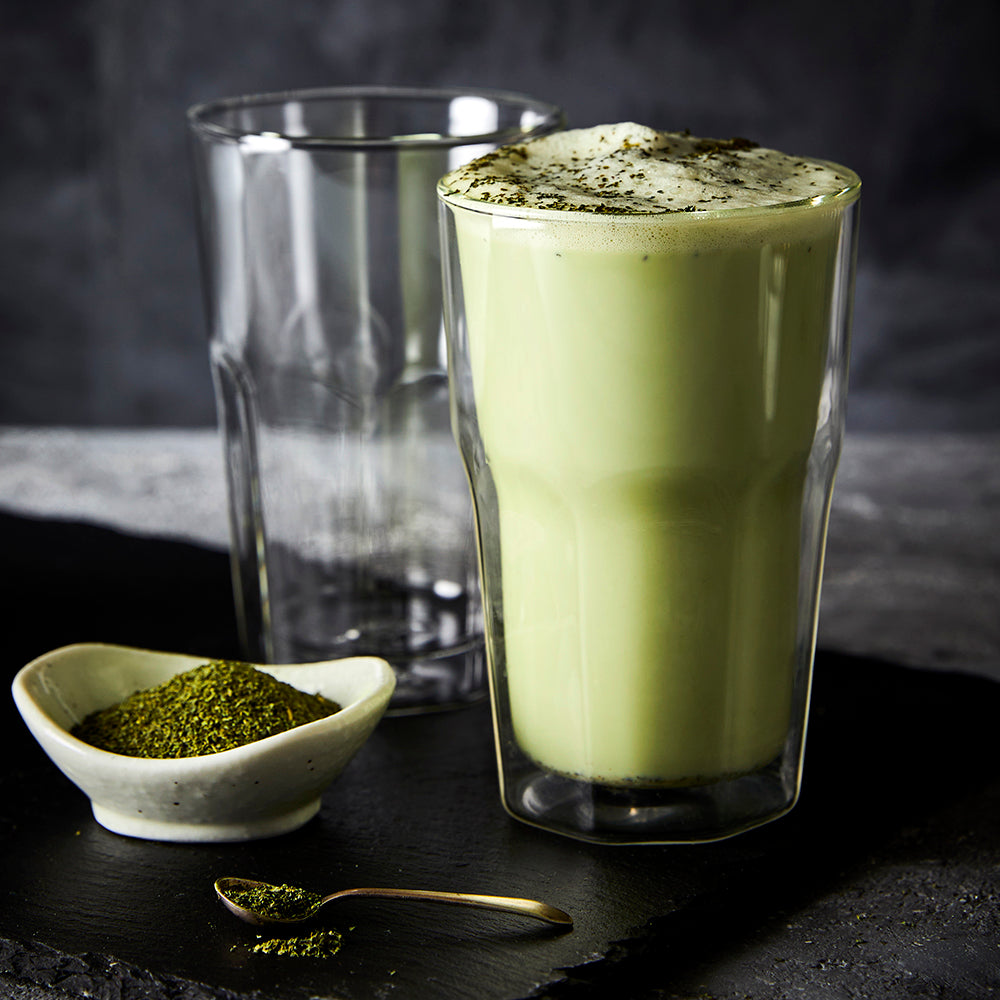creamy matcha latte in double wall glass with rich green color - Baccarat barista facet