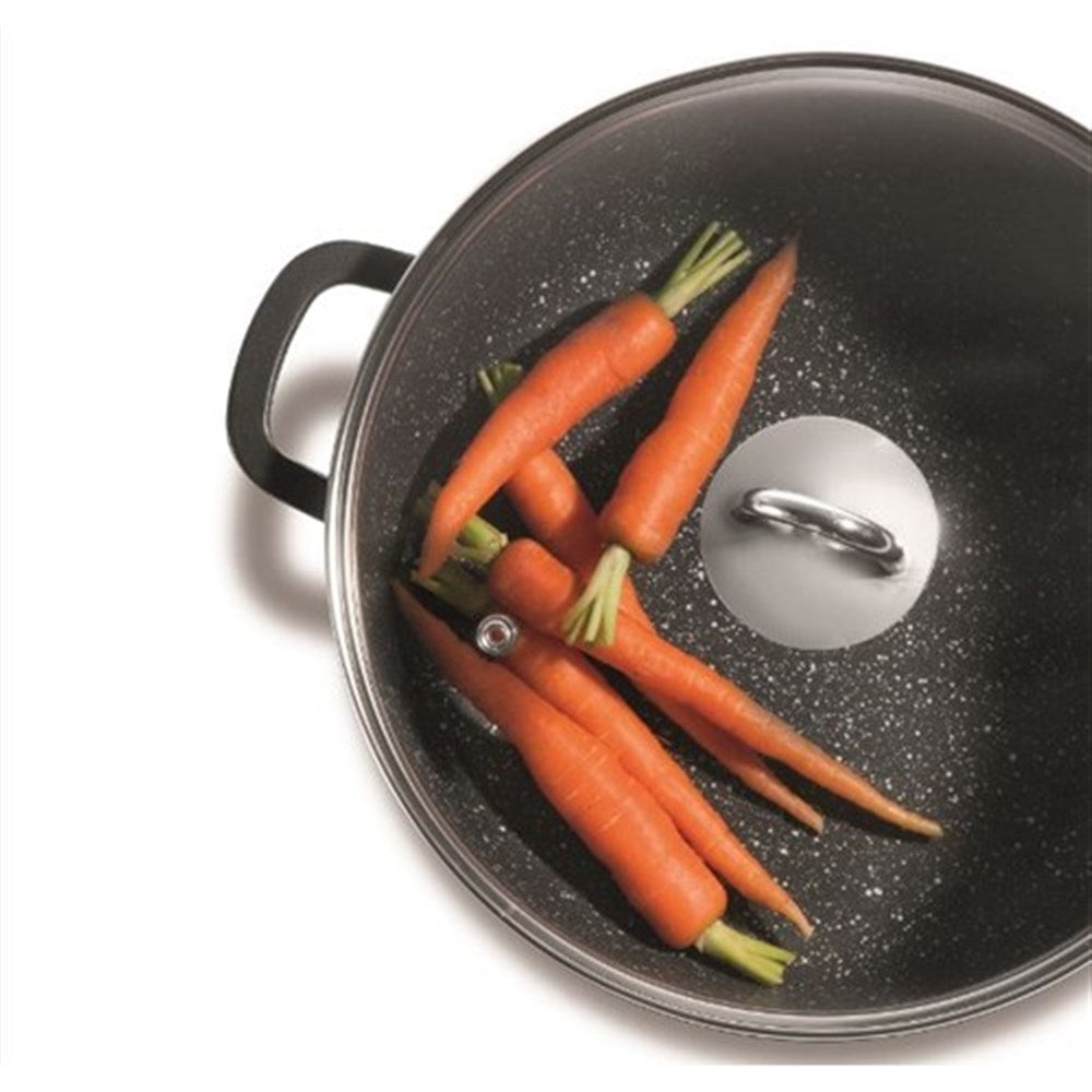 Overhead view of a saute pan filled with fresh vegetables and sliced peppers - Baccarat