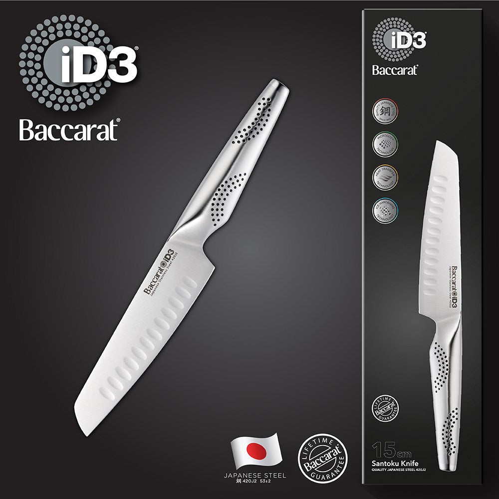 A knife on a wooden cutting board with chopped vibrant vegetables 20cm chefs knife - Baccarat
