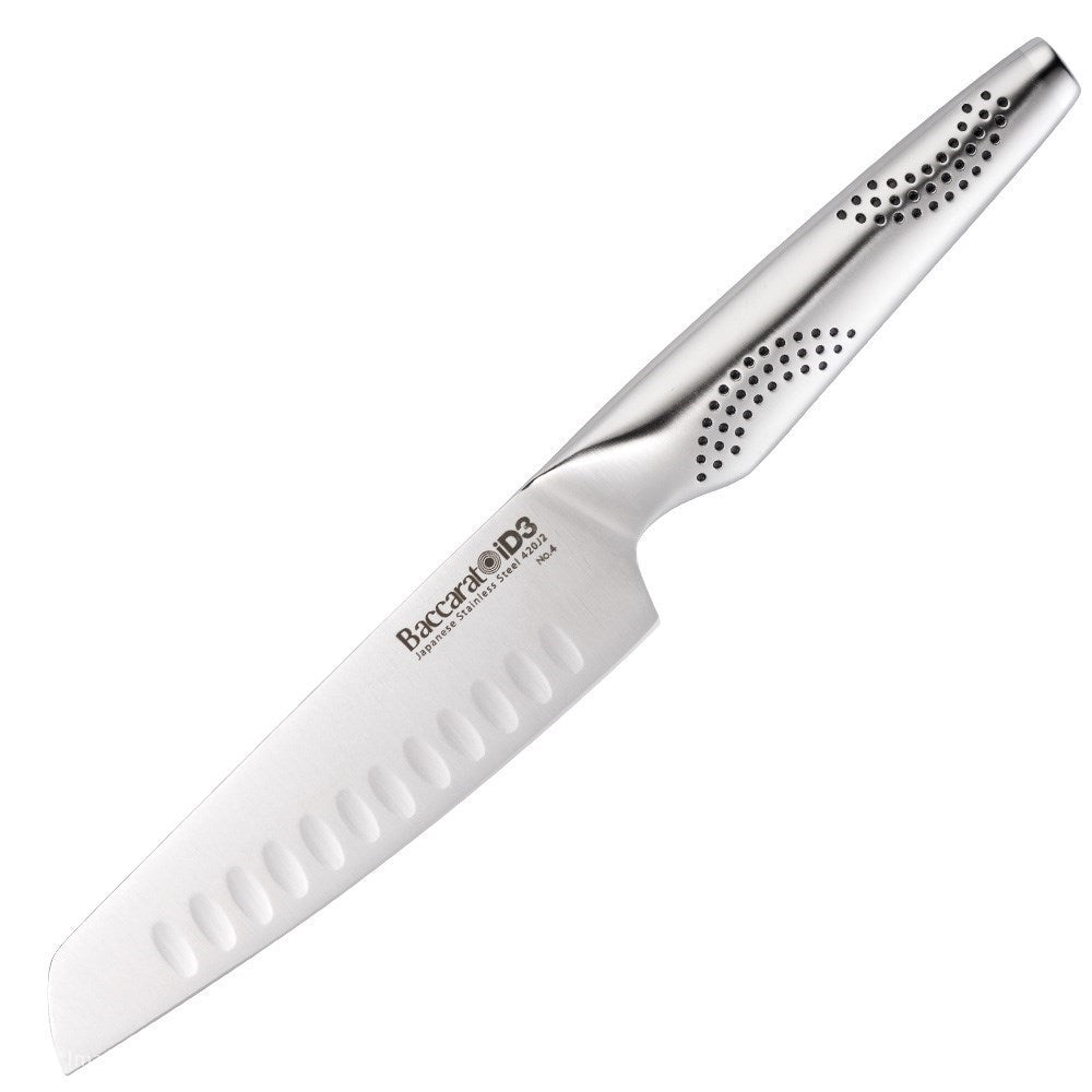 A knife on a wooden cutting board with chopped vibrant vegetables 20cm chefs knife - Baccarat
