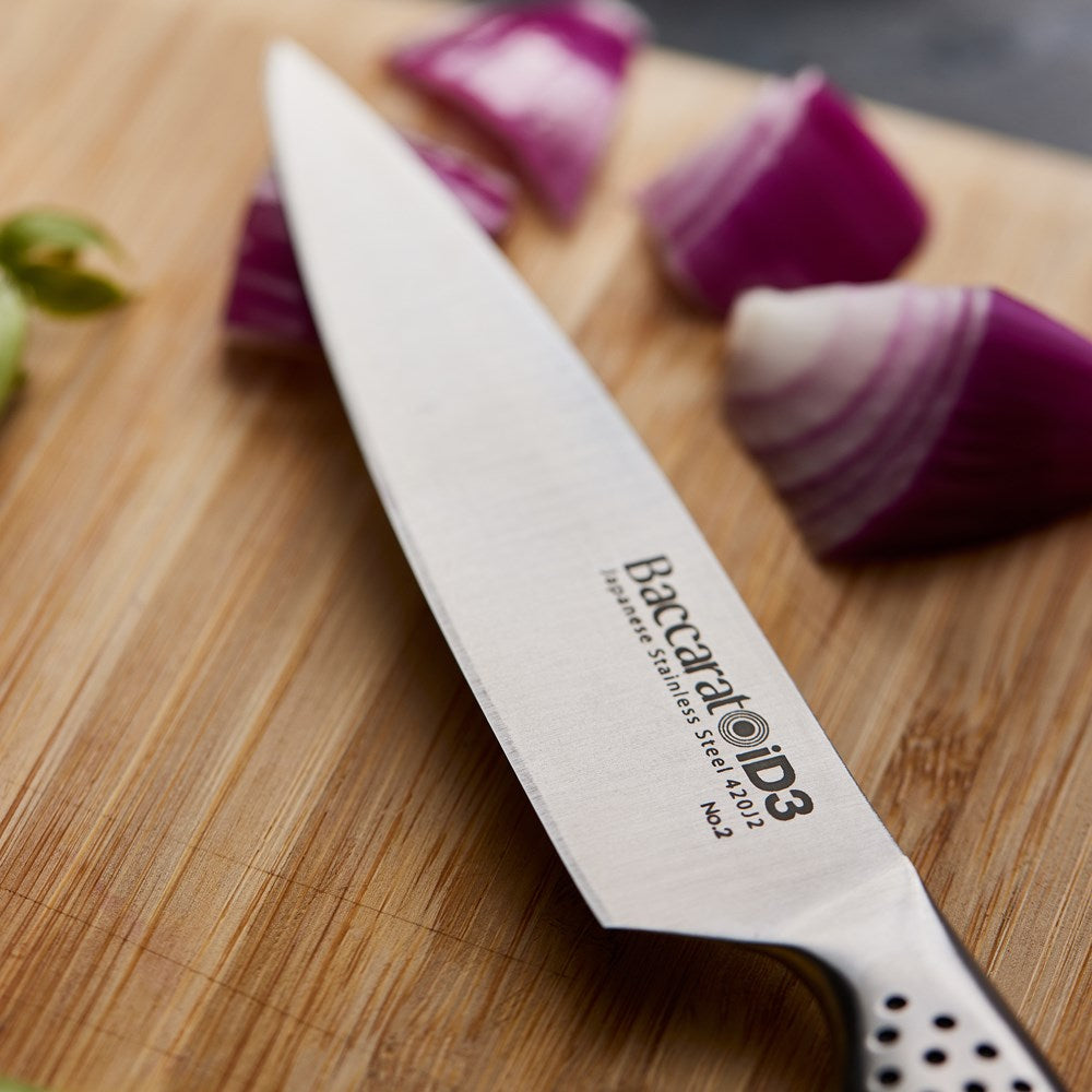 Chopped vegetables on a wooden board with fried veggies in a pan - Baccarat id3 11cm Utility Knife
