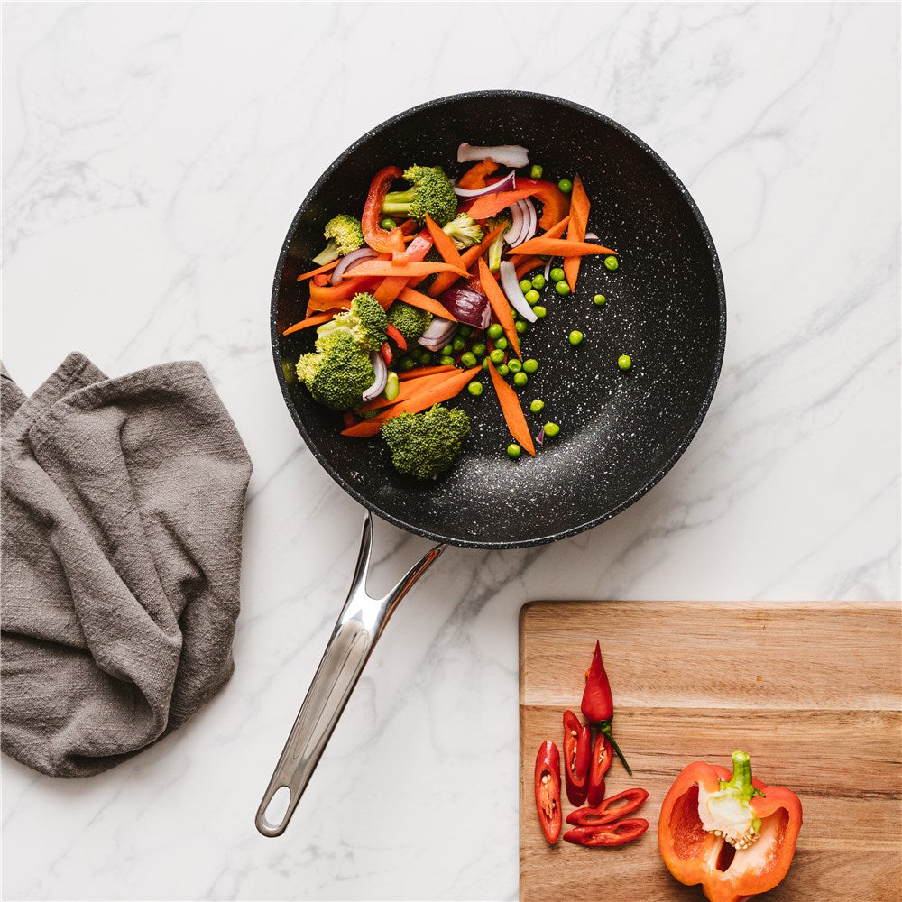 Impact technology with droplets on surface in grey and blue hues - Baccarat rock stir frypan 28cm