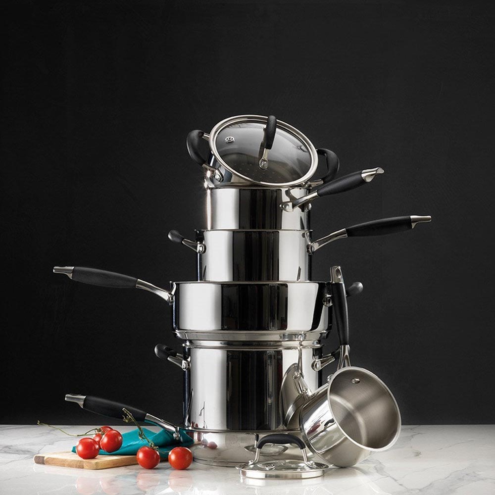 A 20-cm Baccarat Capri Saucepan with a lid filled with corn, chilli, and spices on a countertop