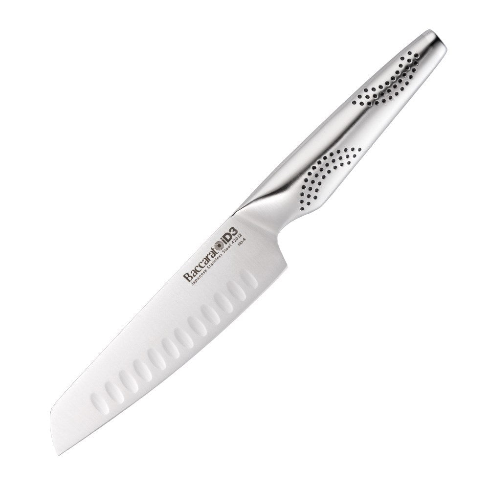 A sleek santoku knife rests on a wooden board surrounded by colourful sliced vegetables - Baccarat