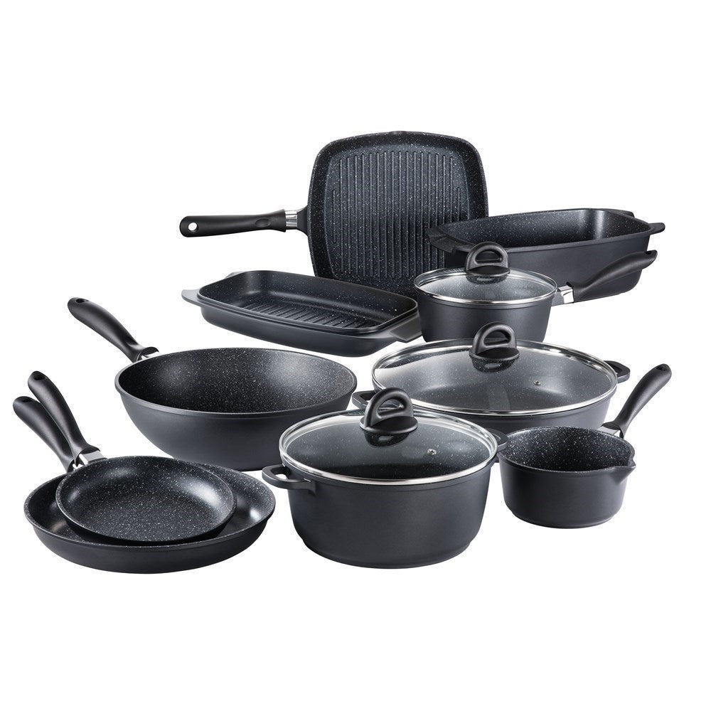 A modern kitchen featuring a sleek stir fry pan and cookware set in stone finish - Baccarat