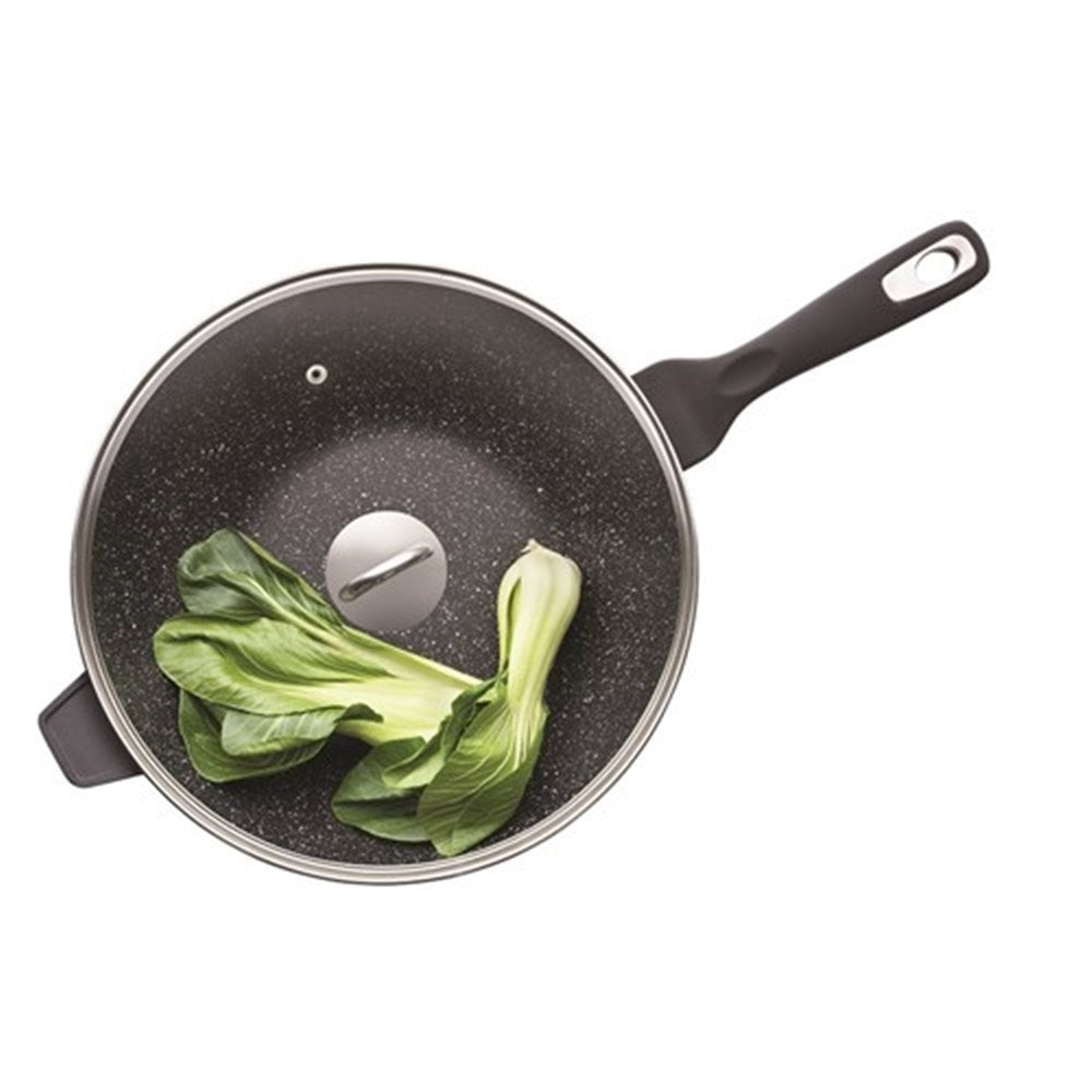Nonstick wok with lid cooking icons and lifetime guarantee in black and white - Baccarat