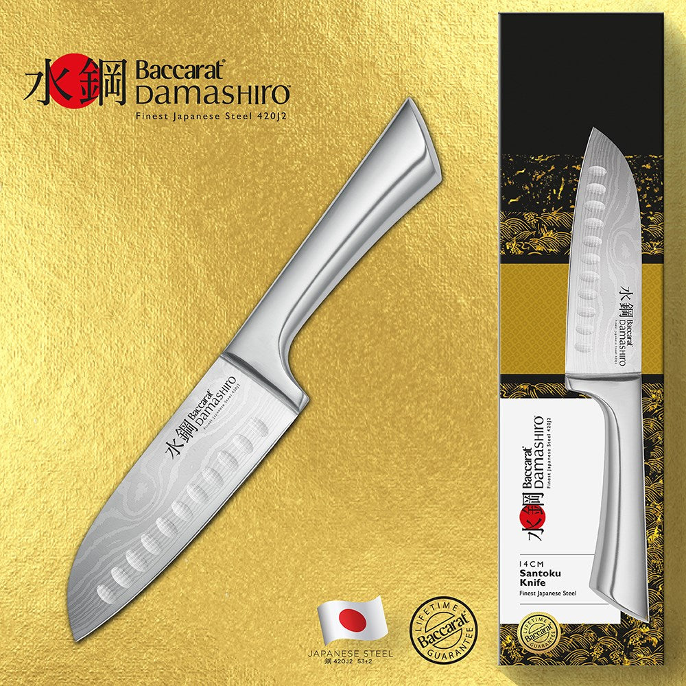 sliced purple shallots on textured surface with shiny blade - Baccarat damashiro santoku knife 14cm