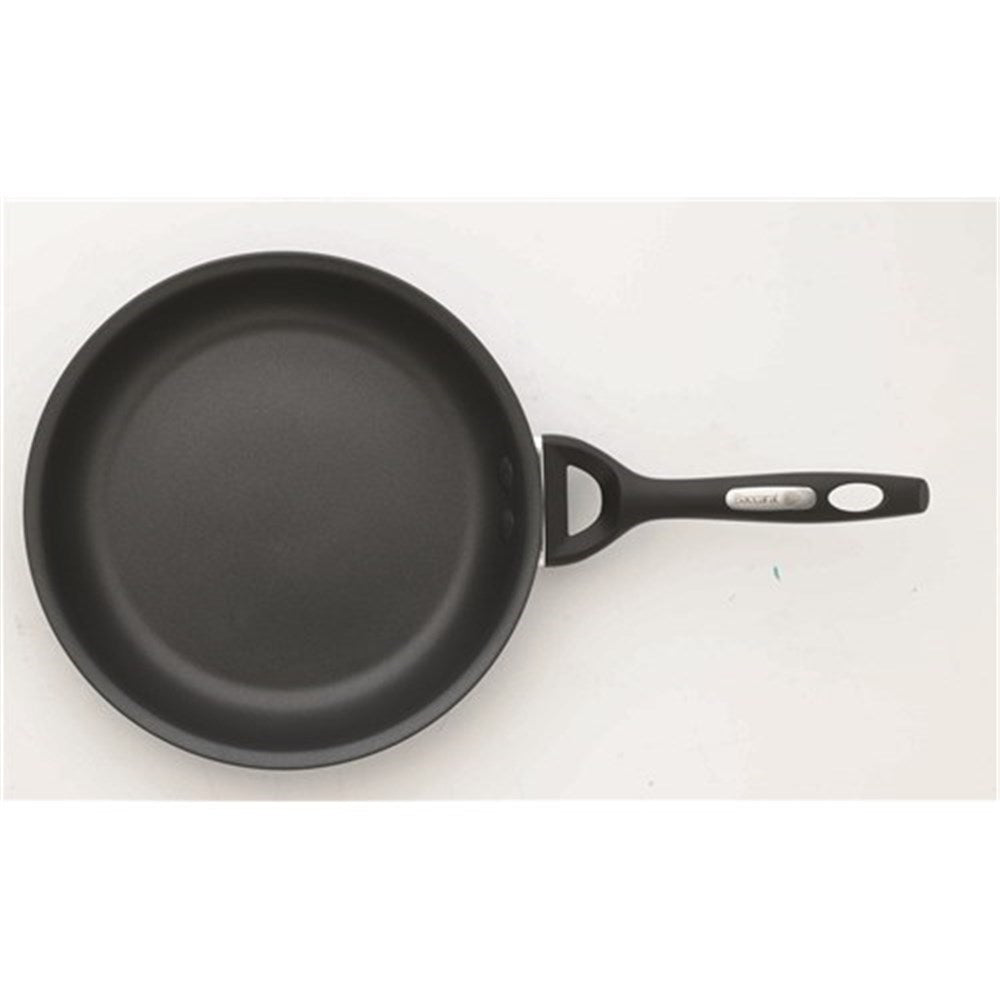 A frying pan filled with a cooked egg greens and potatoes - black non-stick hard anodised - Baccarat