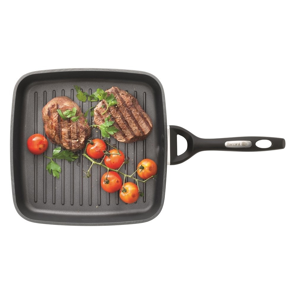 Sliced tomatoes and jalapeños on a cutting board with black griddle - Baccarat id3 cs hard anodised