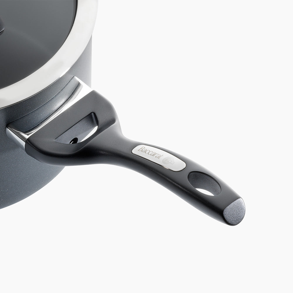 Close-up of a durable saucepan with a lid and bakelite handle - Baccarat id3 cs hard anodised 16cm