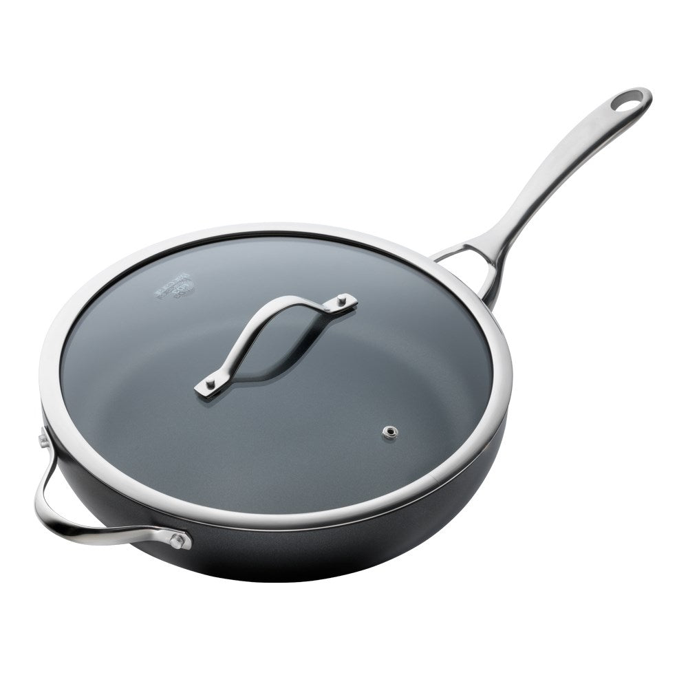 Vibrant cooked meals arranged on a wooden table in a 30cm non stick saute pan with lid - Baccarat