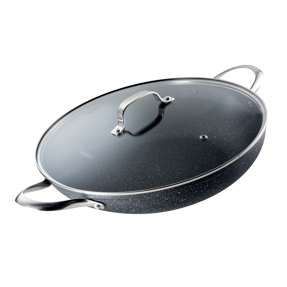 A vibrant vegetable stir fry in a black wok on a marble countertop - 32cm Pan with Lid- Baccarat