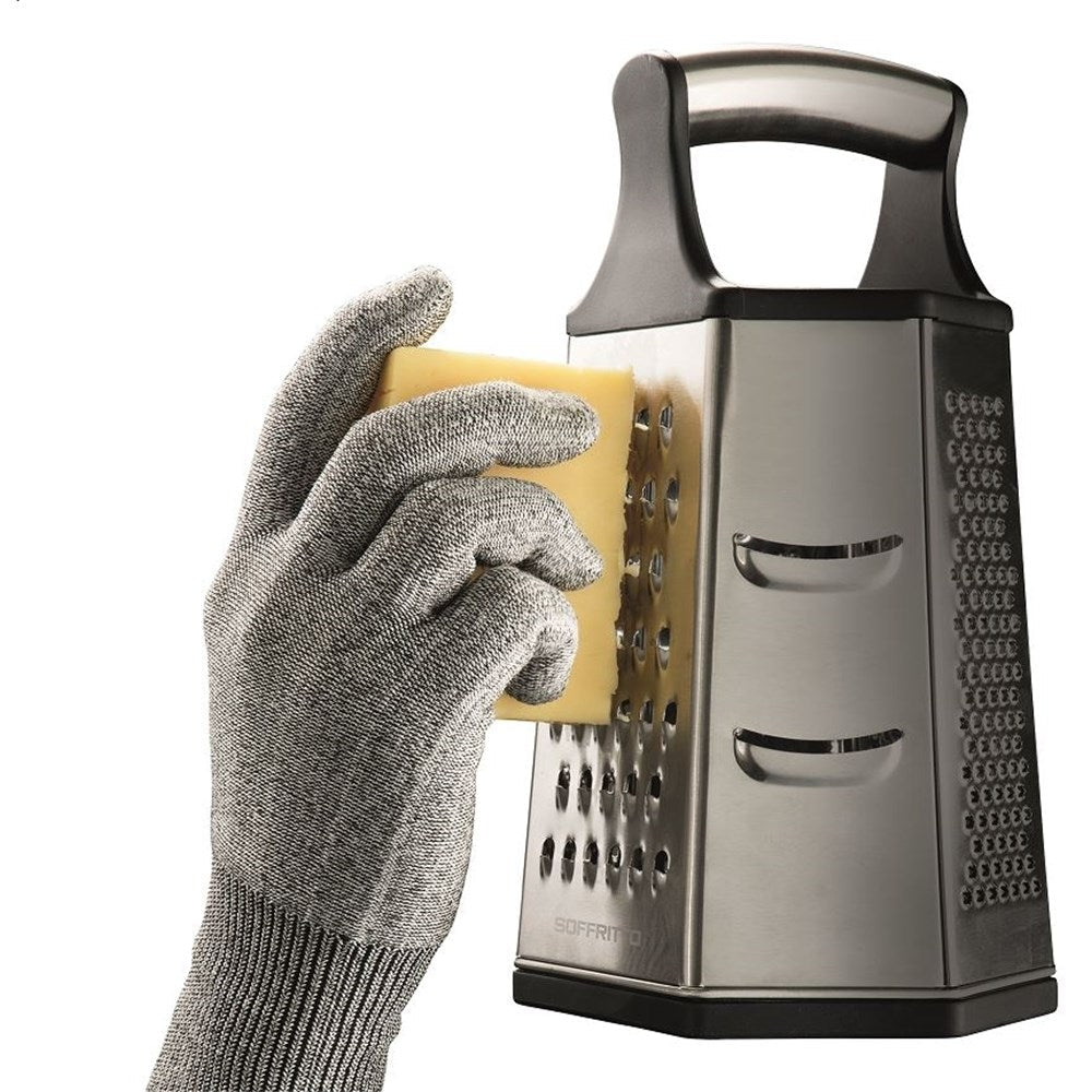 Grating cheese with a protective glove on a stainless steel grater with a sleek design - Baccarat