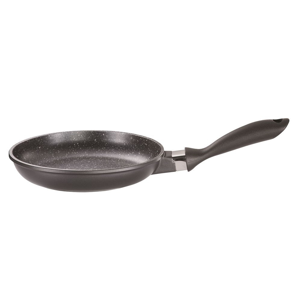 A sleek frying pan on a dark surface beside small plant - Baccarat stone fry pan 16cm