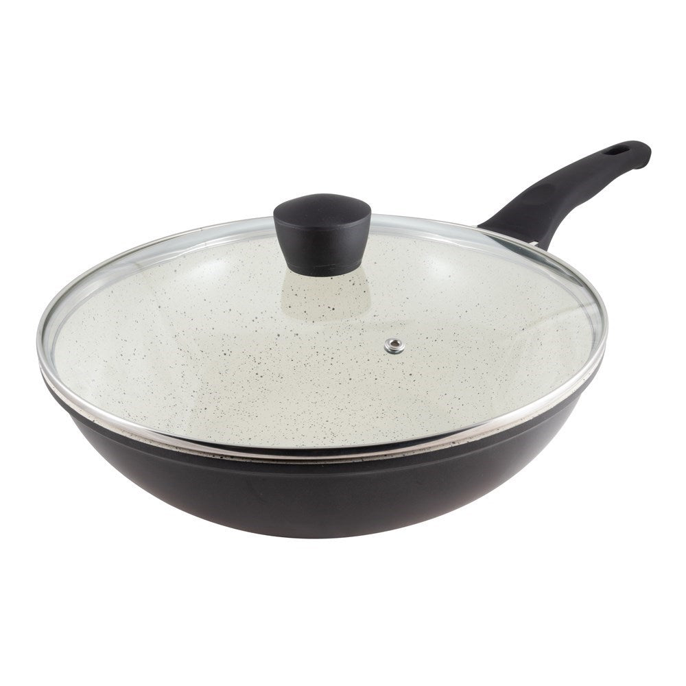 Stir frying colourful vegetables in a black ceramic pan with a glass lid - Baccarat ceramix stirfry