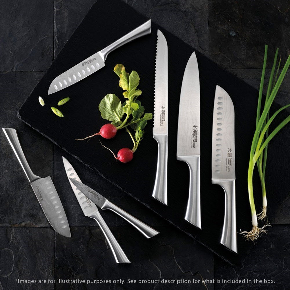 A Baccarat Damashiro Mini chef knife in a protective box with a polished blade and ergonomic handle