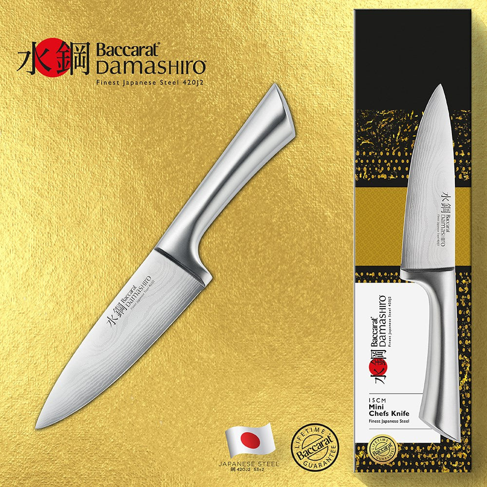 A Baccarat Damashiro Mini chef knife in a protective box with a polished blade and ergonomic handle