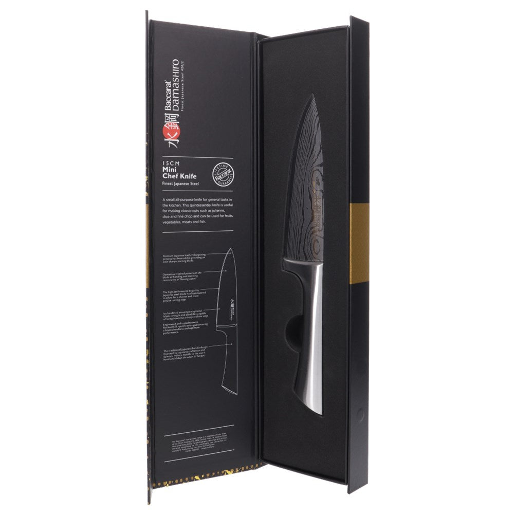 A Baccarat Damashiro Mini chef knife in a protective box with a polished blade and ergonomic handle