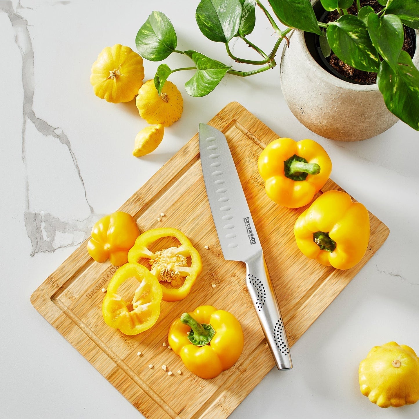 knife block with vibrant yellow peppers and fresh greens - Baccarat damashiro emperor hisa