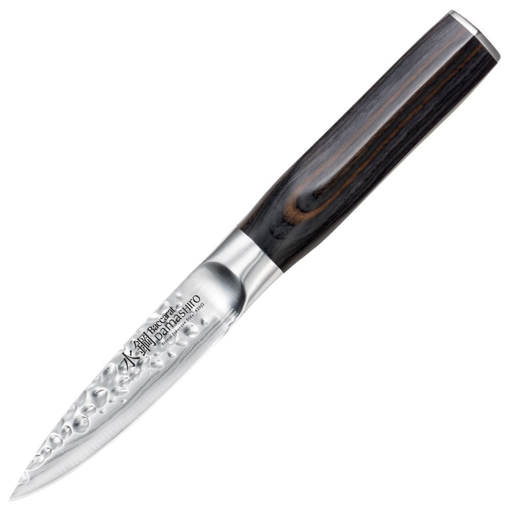 Chopped green herbs on a dark cutting board with a sleek silver knife - Baccarat Damashiro Emperor