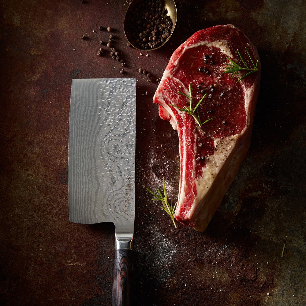 A finely crafted cleaver with a sharp blade and elegant handle design - Baccarat damashiro emperor