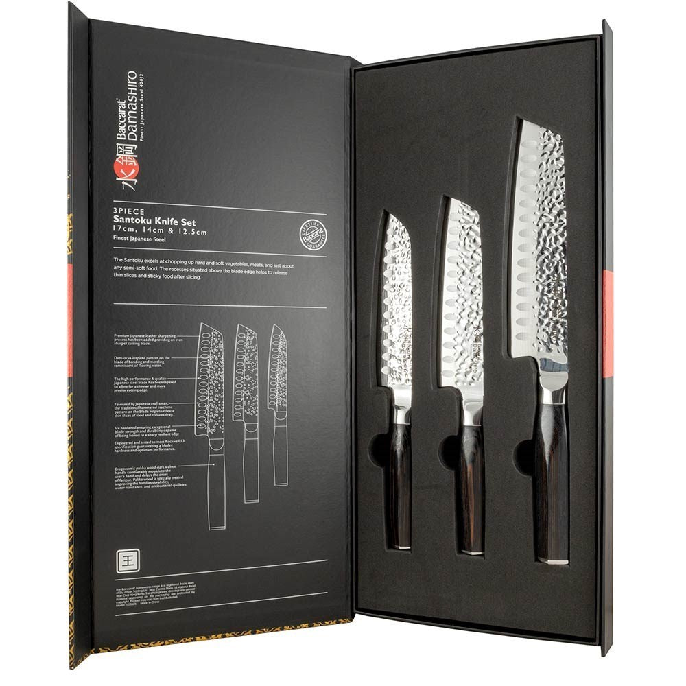 A decorative box with 3-piece knives featuring silver blades and dark handles - Baccarat damashiro