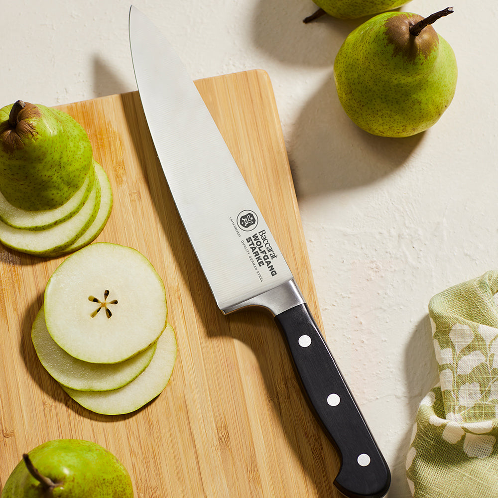 A stainless steel chef's knife with a 20cm blade and a sleek black handle - Baccarat Wolfgang Starke