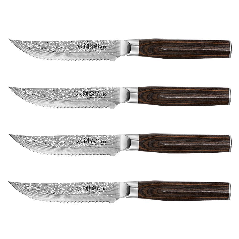 Marbled tomahawk steak with four elegant knives on a dark stone surface - Baccarat damashiro emperor