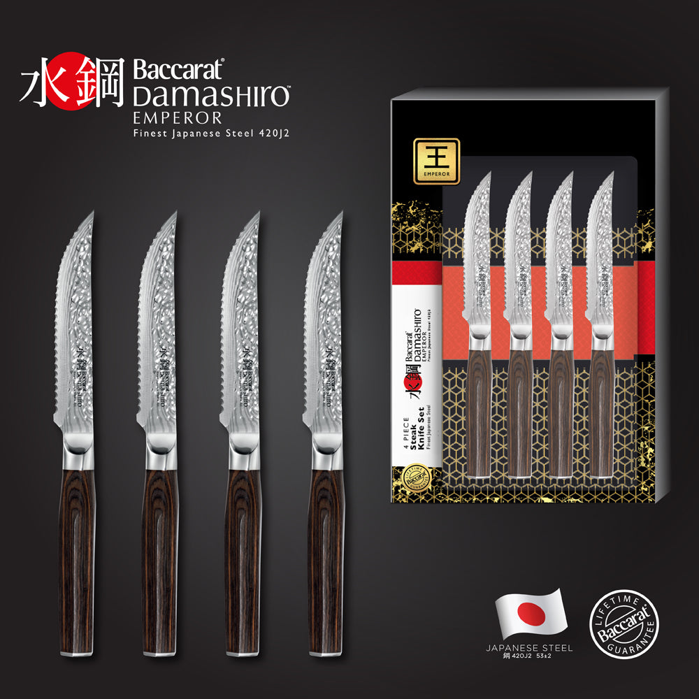 Marbled tomahawk steak with four elegant knives on a dark stone surface - Baccarat damashiro emperor