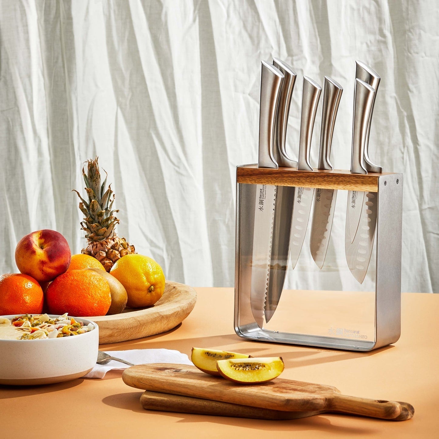 A stunning knife block showcasing sharp elegant blades in fine wood - Baccarat damashiro kinzoku